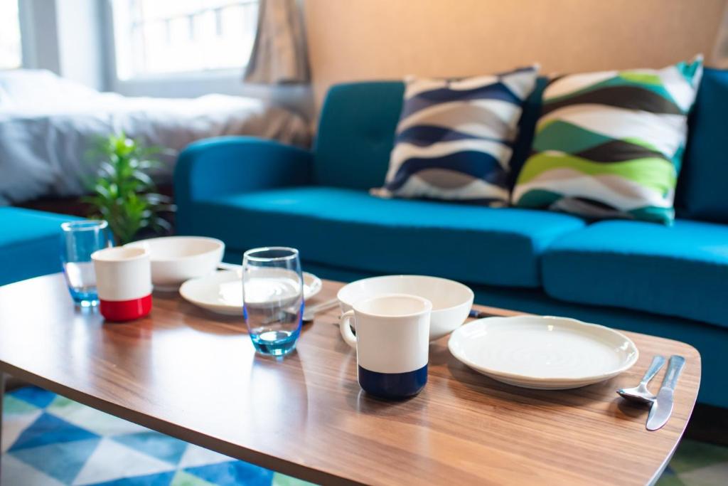 a coffee table with plates and glasses on it at Chatelet Yoyogi - Vacation STAY 15465 in Tokyo