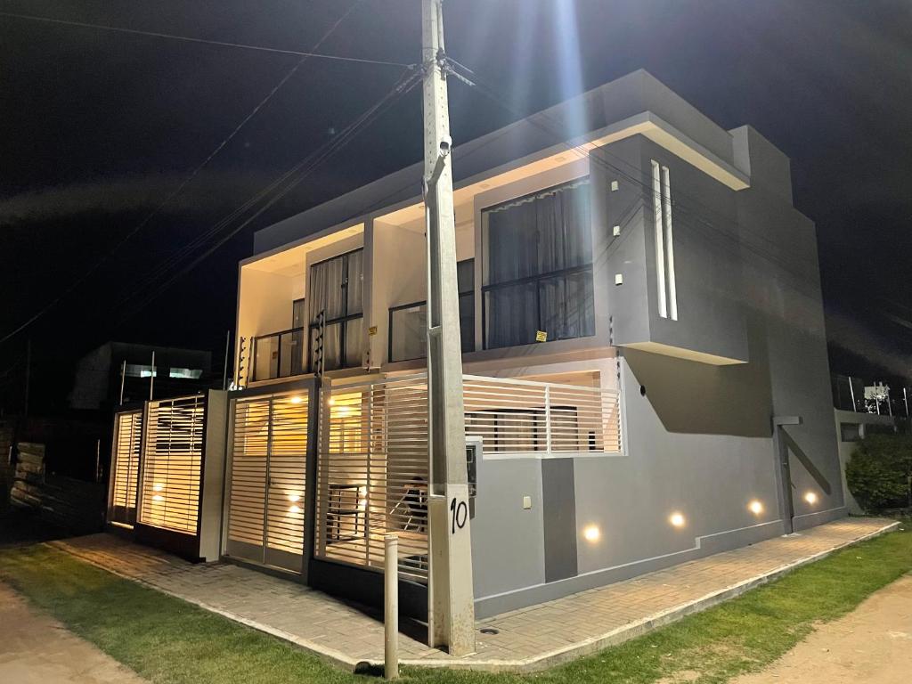 a house at night with a pole in front of it at Flats do Lucca Tamandaré in Tamandaré