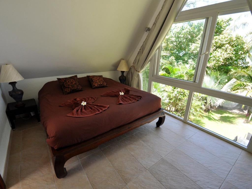 Postel nebo postele na pokoji v ubytování Dragon Sea View Villa