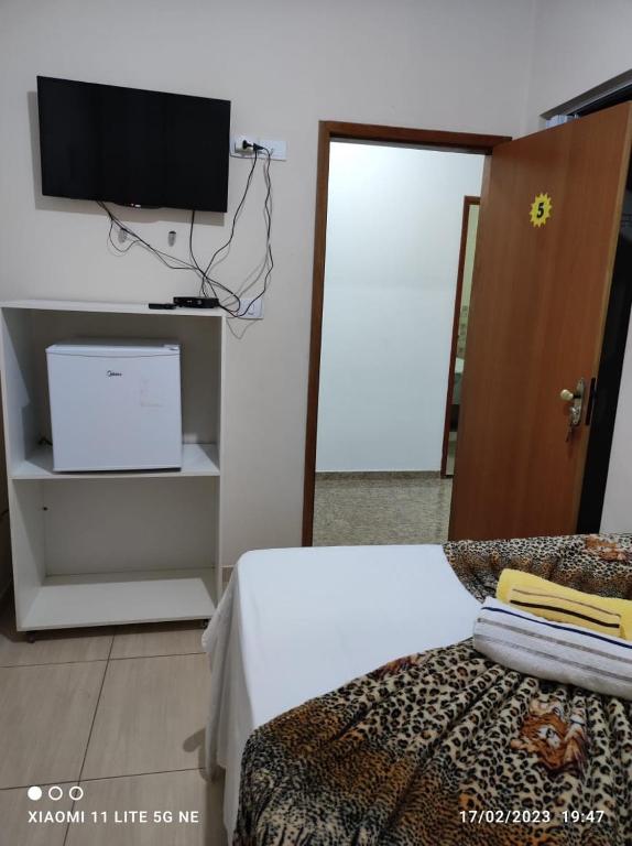 Postel nebo postele na pokoji v ubytování Hotel Raio do Sol