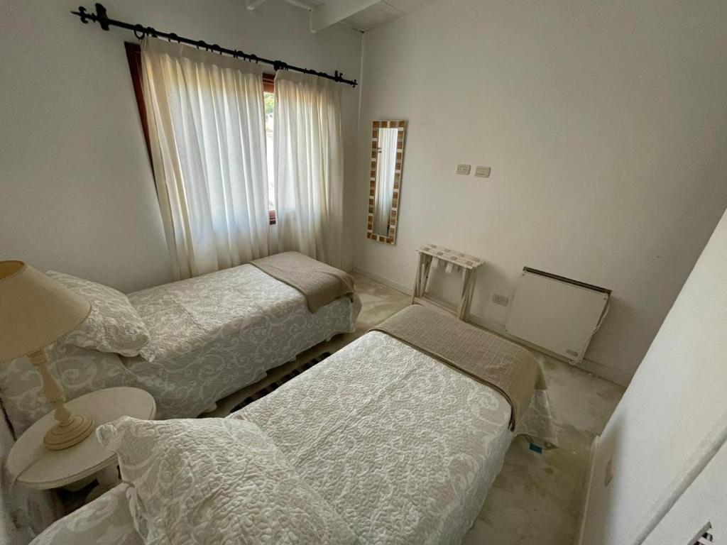 Una cama o camas en una habitación de Cabañas Boutique San Lorenzo