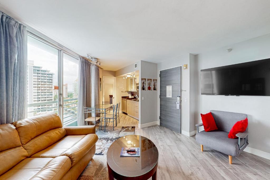 a living room with a couch and a table at Views of the City, 1002 in Fort Lauderdale