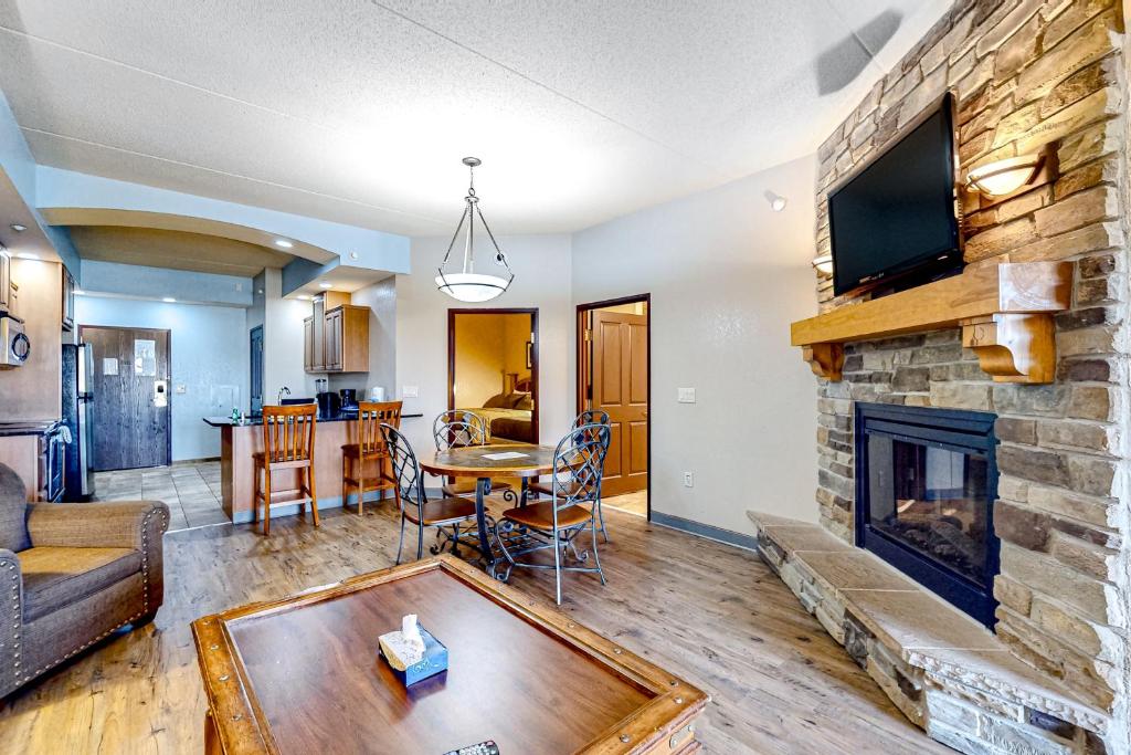 a living room with a fireplace and a tv at Chula Vista Condo 2344 and 2346 in Wisconsin Dells