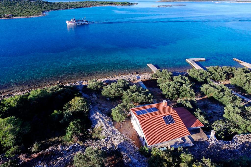an aerial view of a house on a island in the water at House Sea Cloud in Pašman