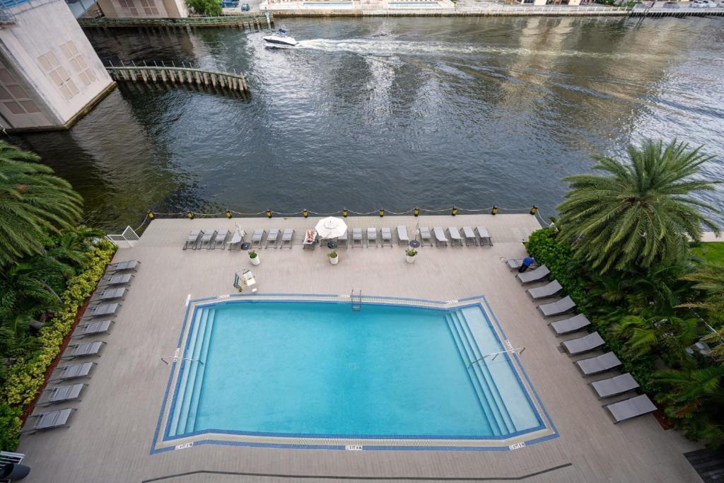an overhead view of a swimming pool and a river at Hallandale Sky Water View in Hallandale Beach