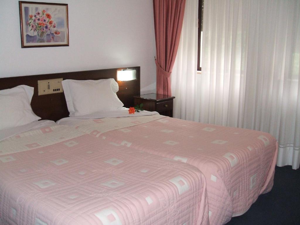 Postel nebo postele na pokoji v ubytování Hotel Boavista I