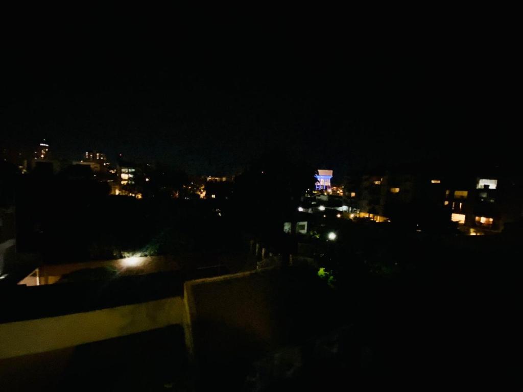 a view of a city at night with lights at NOTRE SOUL in Tigre