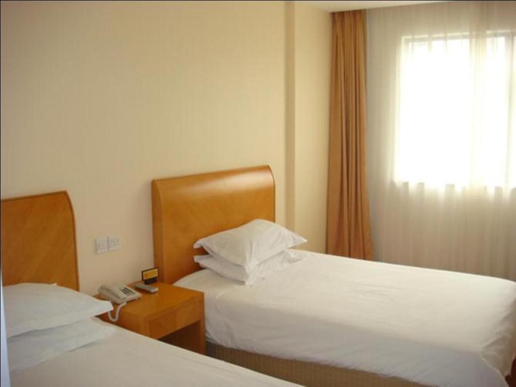 Postel nebo postele na pokoji v ubytování Jinjiang Inn - Shanghai Changning