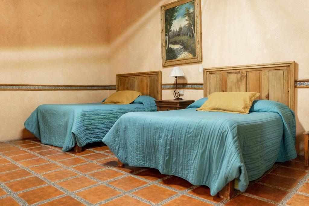 Postel nebo postele na pokoji v ubytování Hotel CasaMia