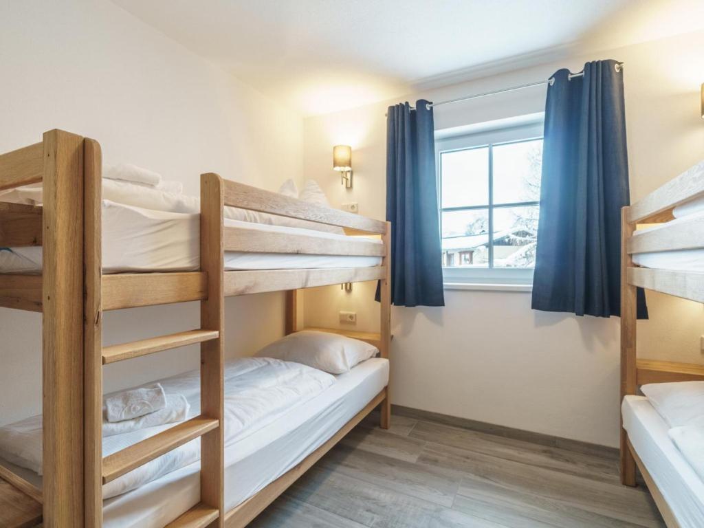 Posteľ alebo postele v izbe v ubytovaní Pinzgau Lodge 2B