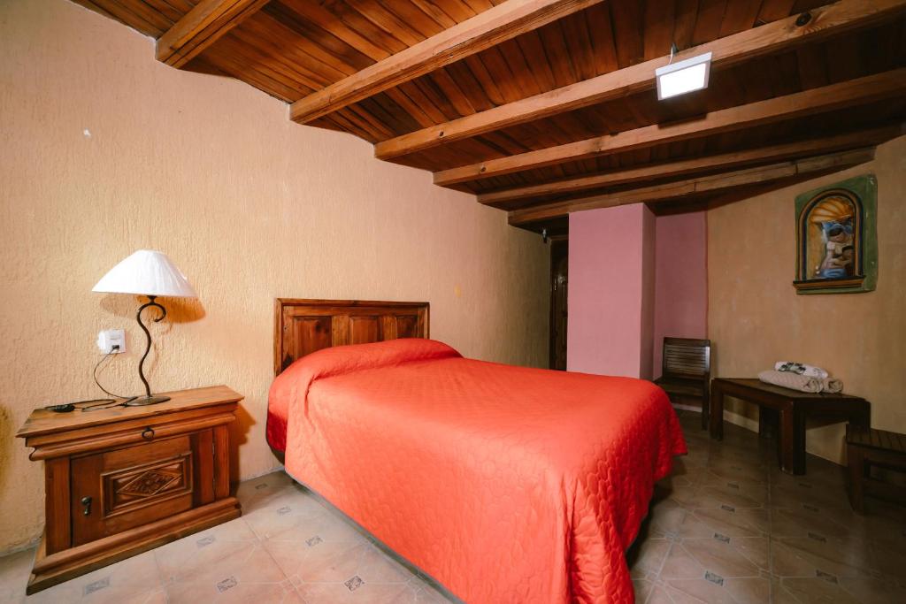 Postel nebo postele na pokoji v ubytování Hotel CasaMia