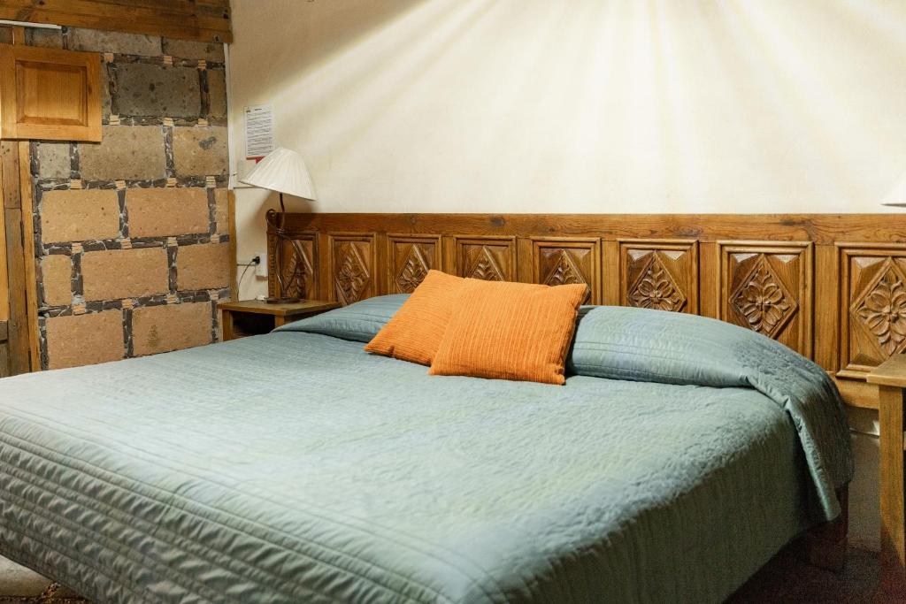 Postel nebo postele na pokoji v ubytování Hotel CasaMia