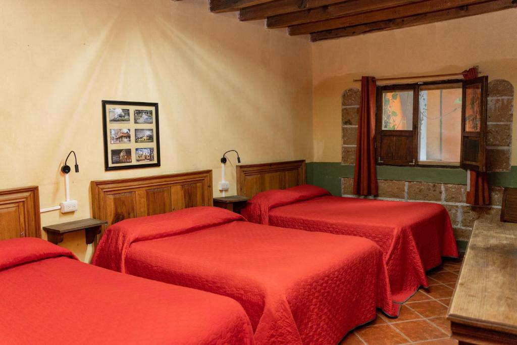 Postel nebo postele na pokoji v ubytování Hotel CasaMia