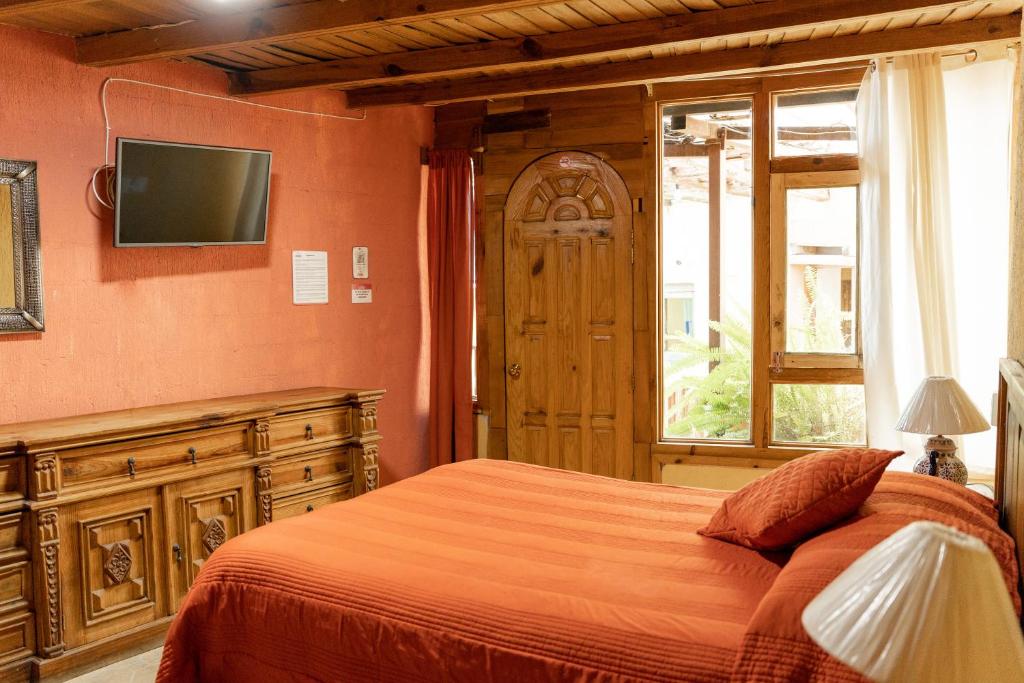 Postel nebo postele na pokoji v ubytování Hotel CasaMia