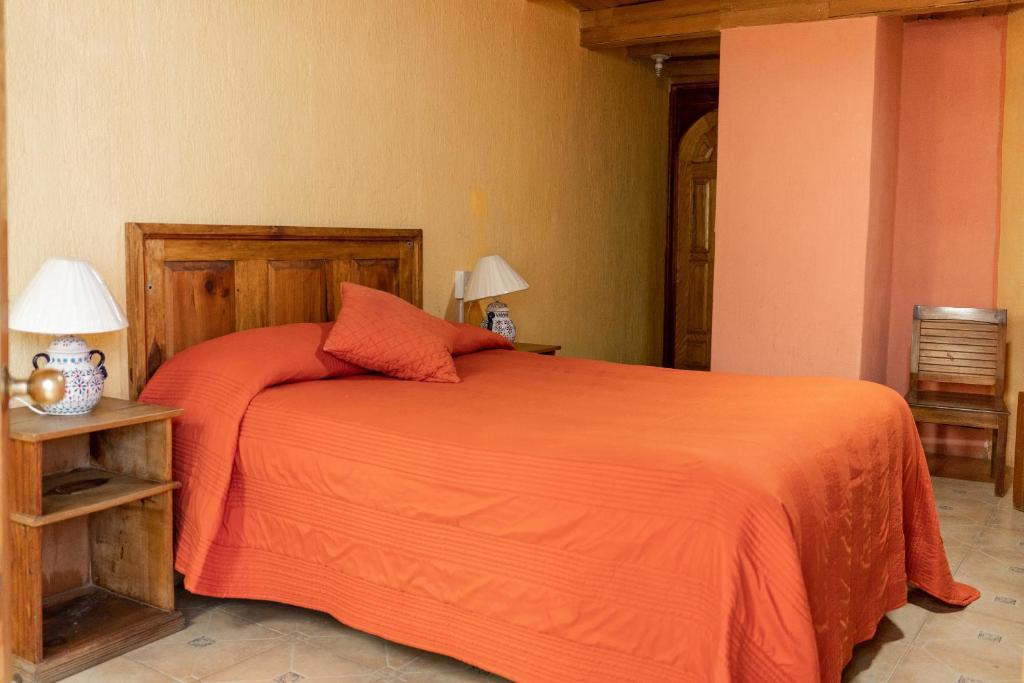Postel nebo postele na pokoji v ubytování Hotel CasaMia
