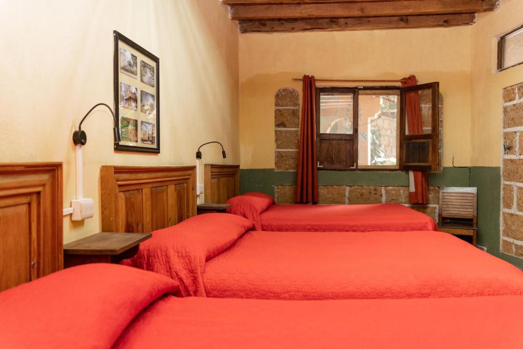 Postel nebo postele na pokoji v ubytování Hotel CasaMia