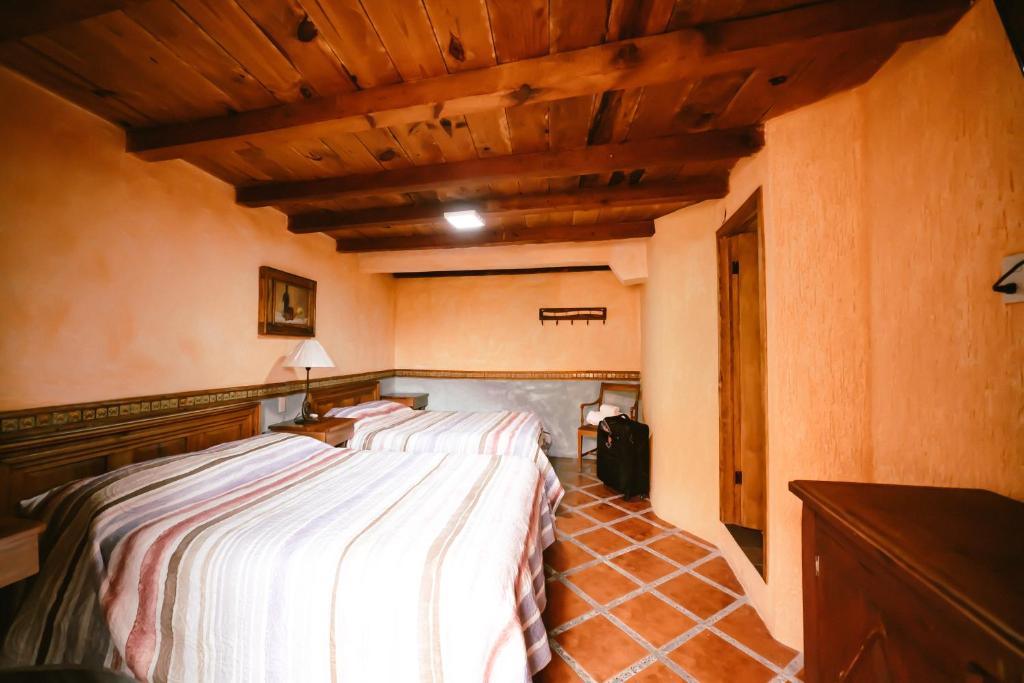 Postel nebo postele na pokoji v ubytování Hotel CasaMia