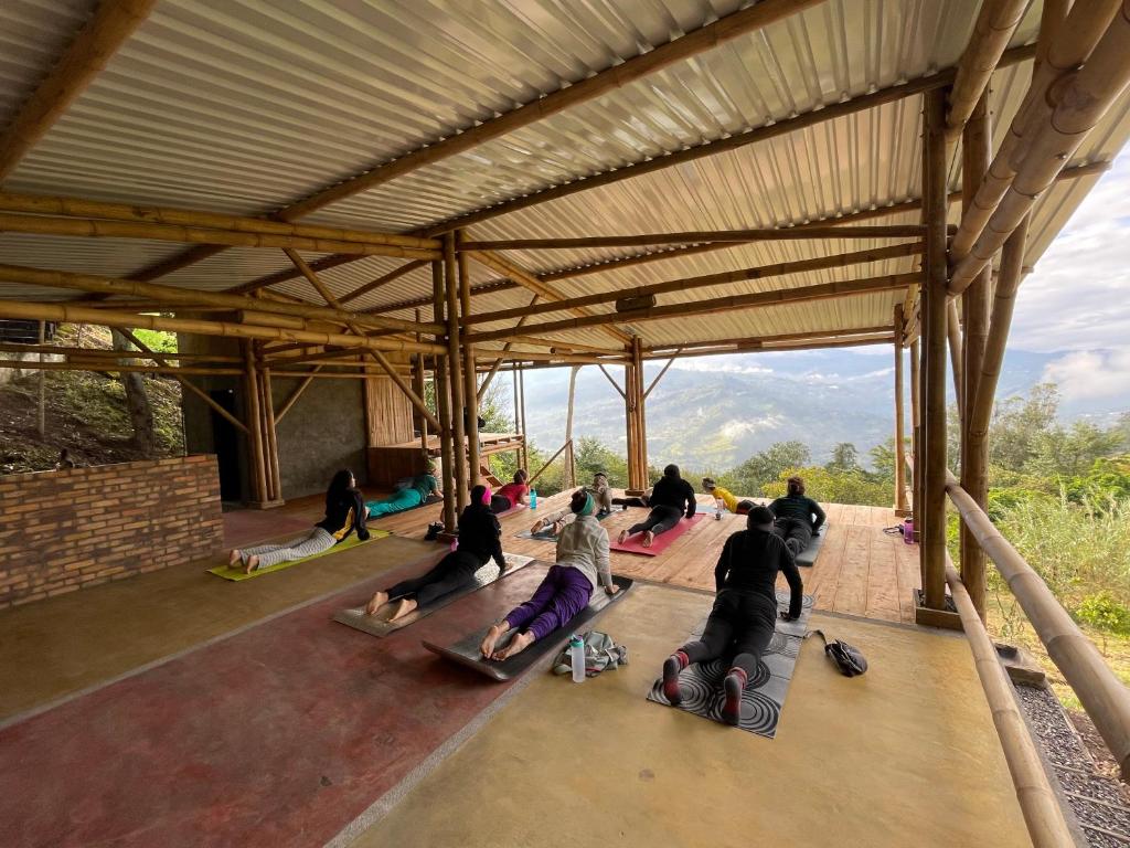 a group of people on skateboards in a building at Refugio Explora Verde in Choachí