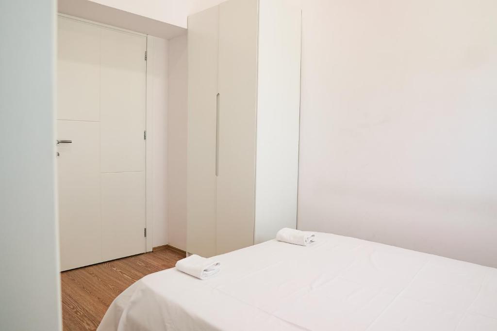 Uma cama ou camas num quarto em Mega Hotel