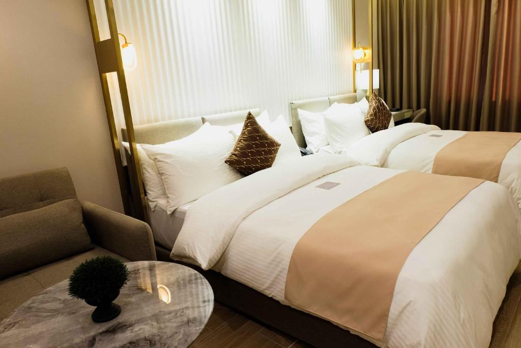 Postel nebo postele na pokoji v ubytování Uma Hotel and Residences