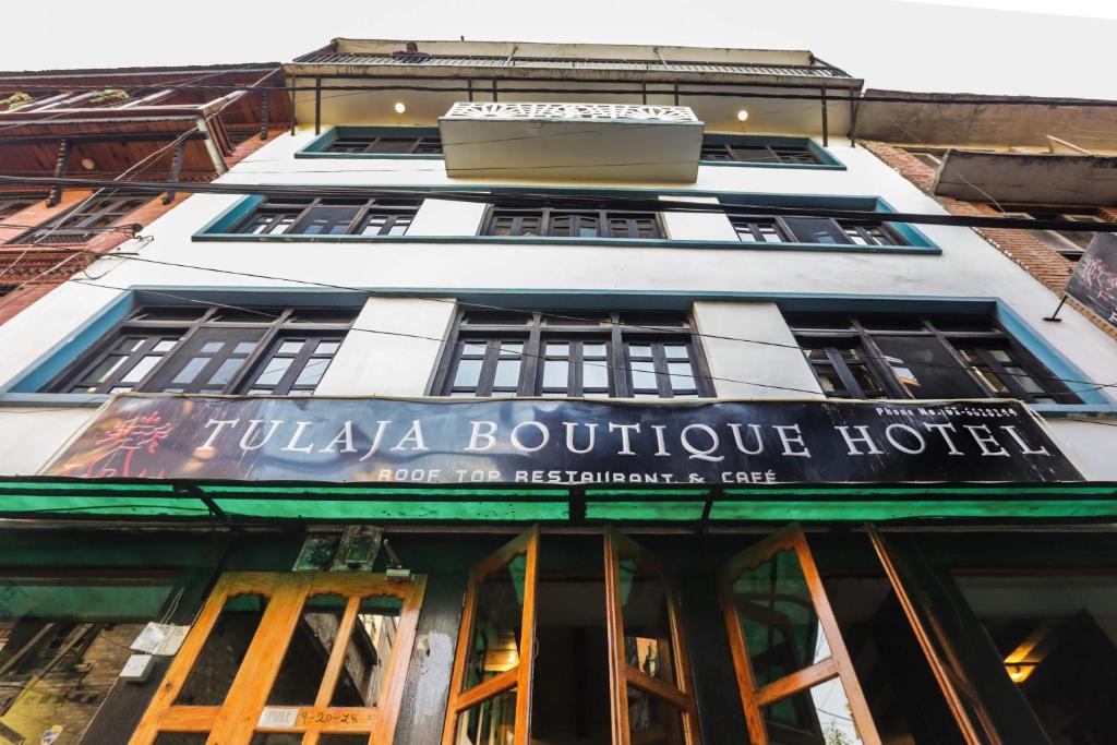 a building with a sign that reads tuas boutique hotel at Tulaja Boutique Hotel in Bhaktapur