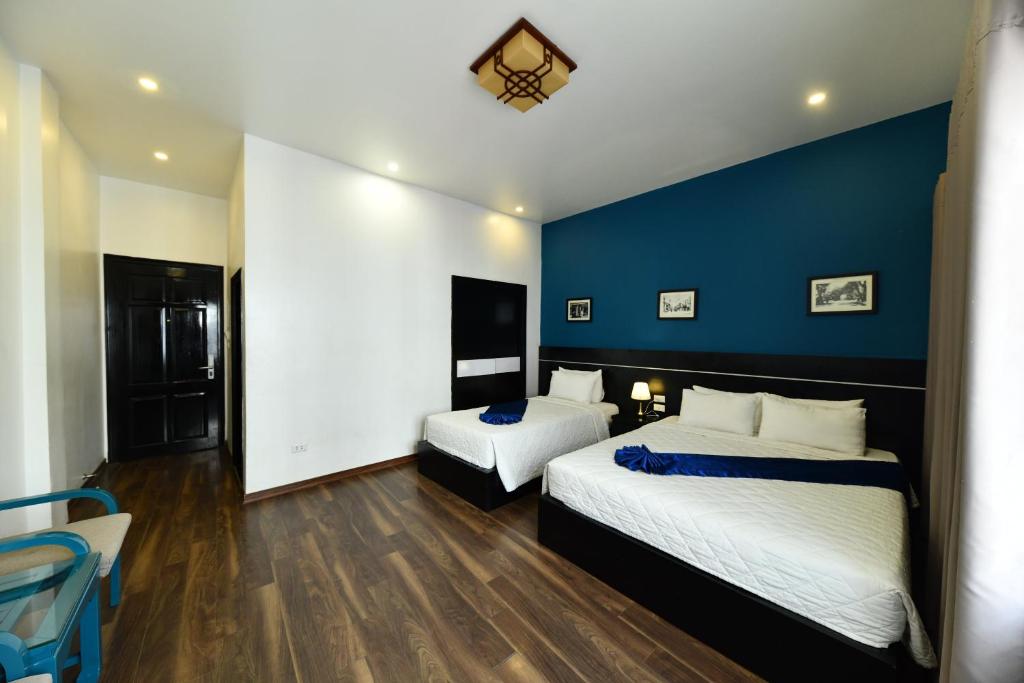 Postel nebo postele na pokoji v ubytování Hanoi Starlight Boutique Hotel