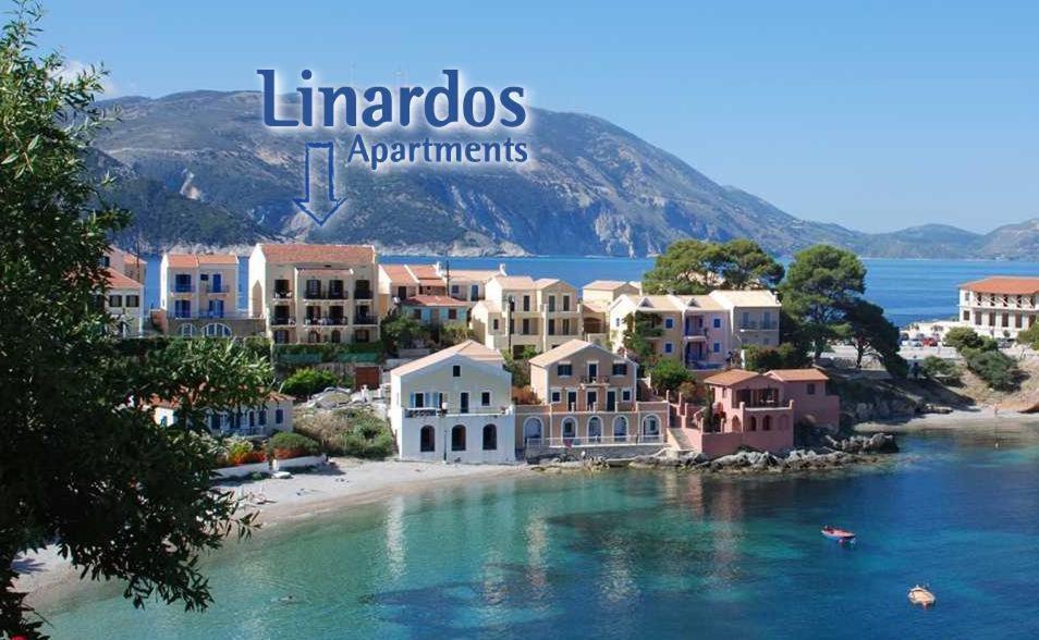 a view of a town on a beach in the water at Linardos Apartments in Asos
