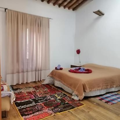 a bedroom with a bed and a rug at Casa Bosco in San Polo