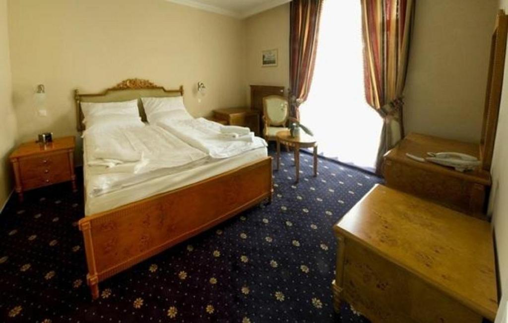 Postel nebo postele na pokoji v ubytování Luxury Garni Hotel Brix