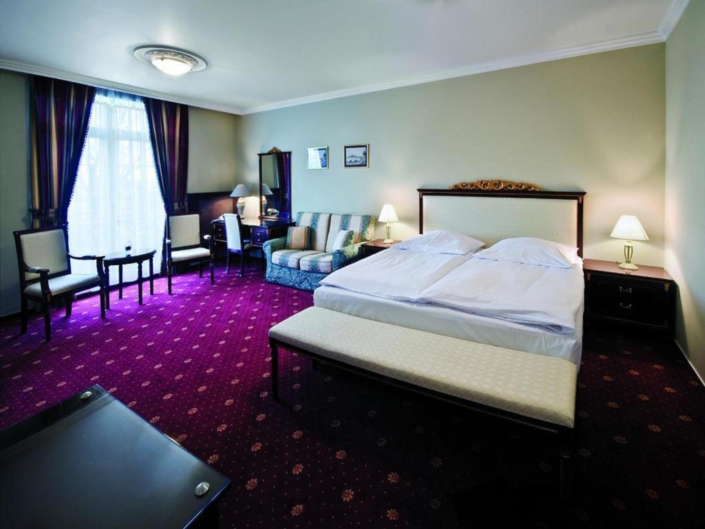 Postel nebo postele na pokoji v ubytování Luxury Garni Hotel Brix