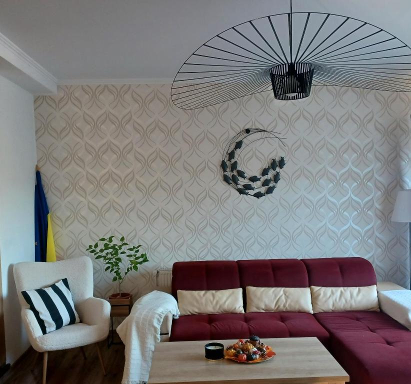 a living room with a couch and a table at Vila Gloria ,Brașov in Ghimbav