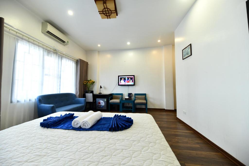 Postel nebo postele na pokoji v ubytování Hanoi Starlight Boutique Hotel