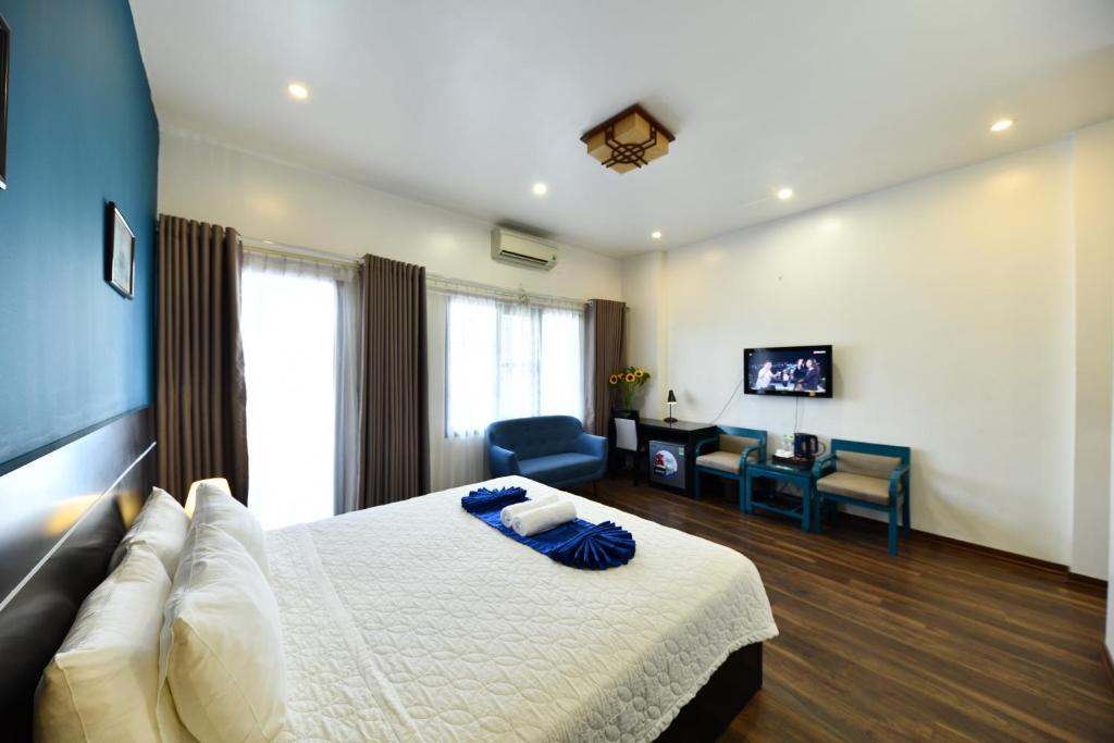 Postel nebo postele na pokoji v ubytování Hanoi Starlight Boutique Hotel
