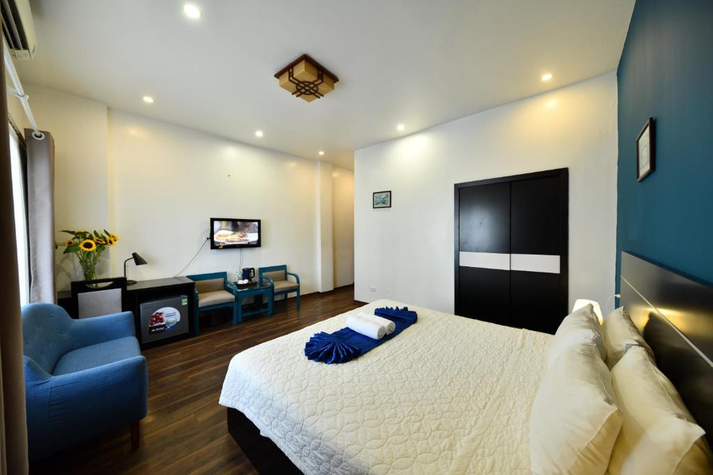 Postel nebo postele na pokoji v ubytování Hanoi Starlight Boutique Hotel