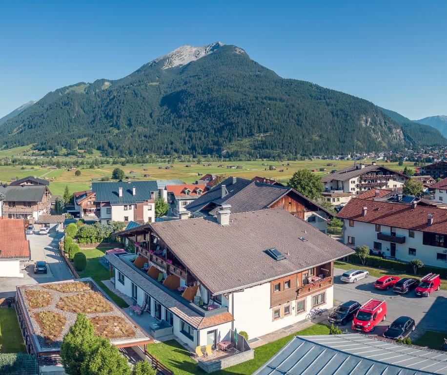 an aerial view of a small town with a mountain at Gästehaus Wilhelmshof in Ehrwald