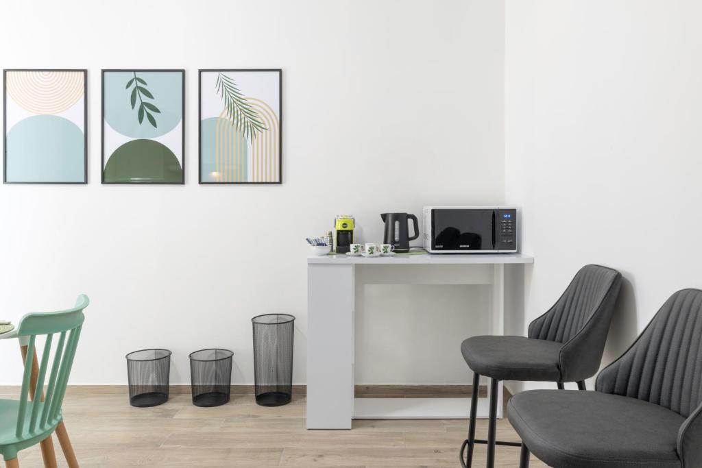 TV a/nebo společenská místnost v ubytování Quarzo Modern Rooms