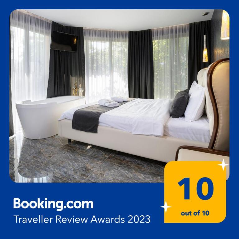 a bedroom with a bed and a bath tub at THE HIDDEN BANK: Silver Bullet in Plovdiv
