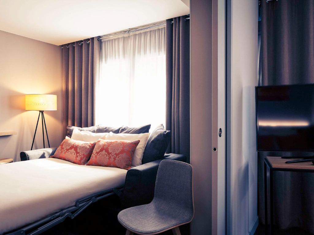 Postel nebo postele na pokoji v ubytování Mercure Lyon Charbonnières