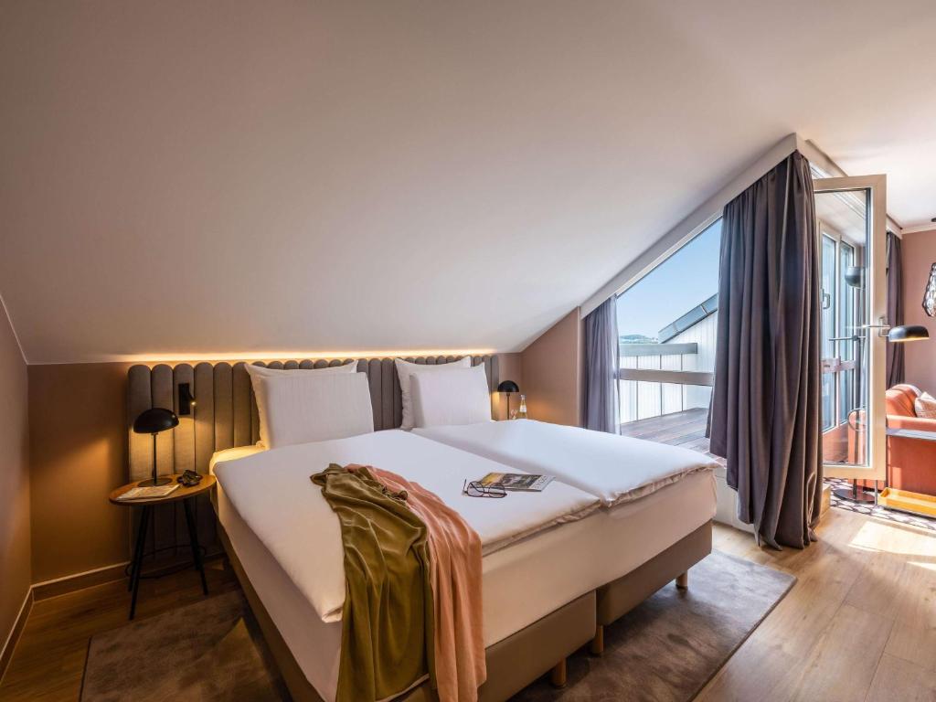 Postel nebo postele na pokoji v ubytování Pullman Stuttgart Fontana