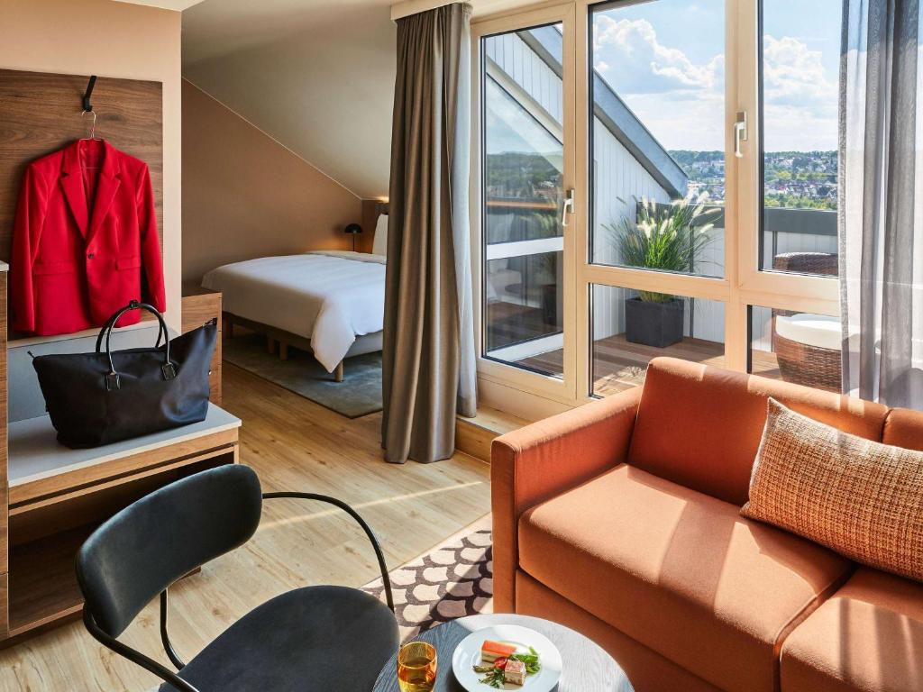 Postel nebo postele na pokoji v ubytování Pullman Stuttgart Fontana