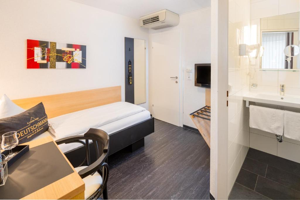 Postel nebo postele na pokoji v ubytování 4-Länder-Hotel Deutschmann