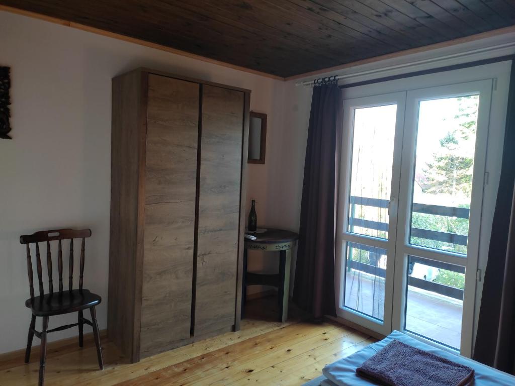 A bed or beds in a room at Kenderhordó Pihenőház