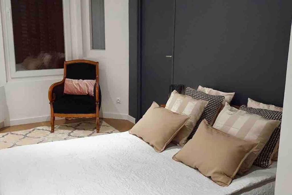 Una cama o camas en una habitaci&oacute;n de Appartement 40m2 centre de Vichy