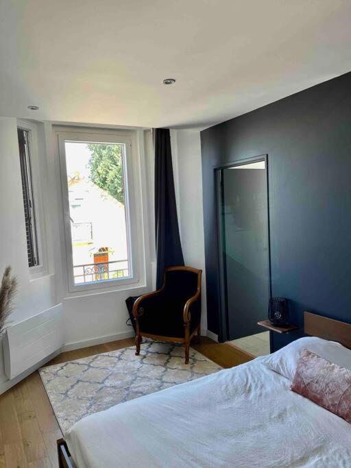 Una cama o camas en una habitaci&oacute;n de Appartement 40m2 centre de Vichy