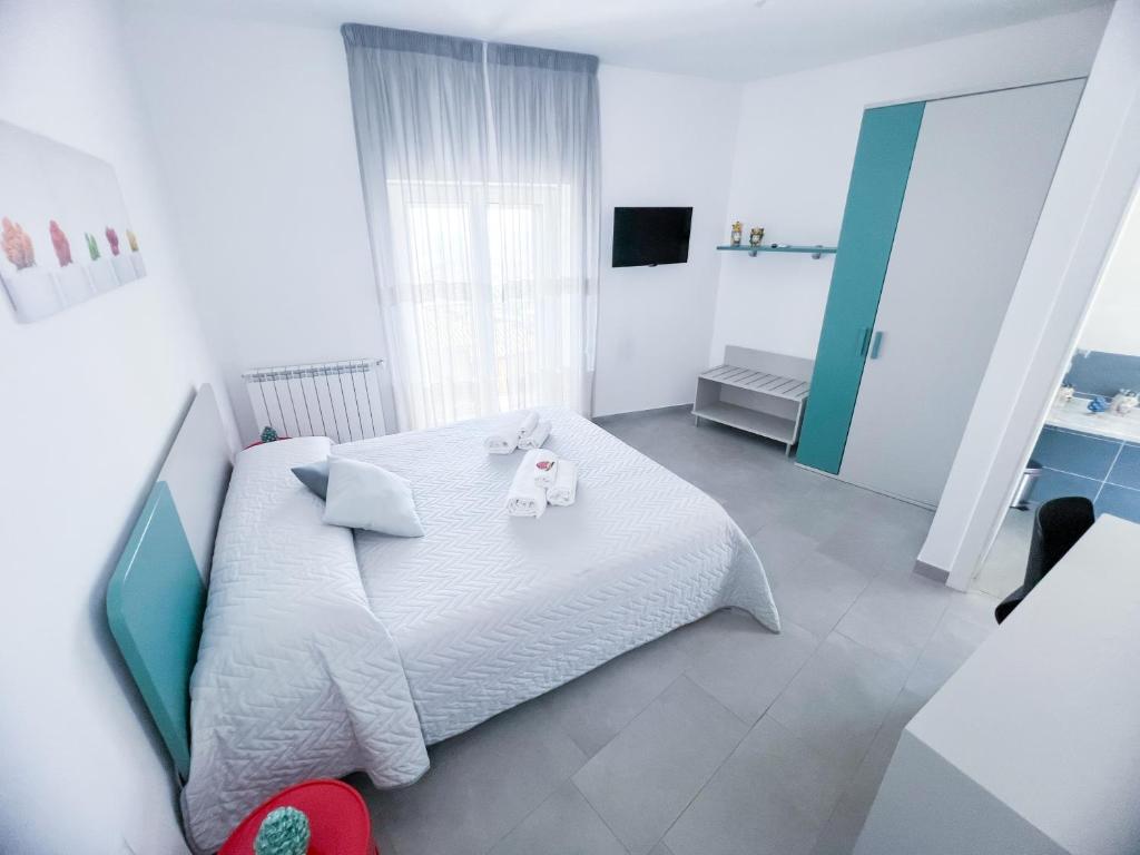 Łóżko lub łóżka w pokoju w obiekcie Appartamento al centro storico