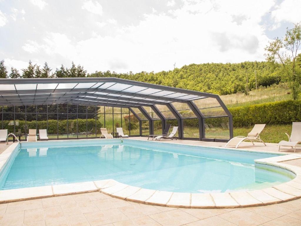 a large swimming pool with a metal canopy over it at Property in Trivigno PZ in Trivigno