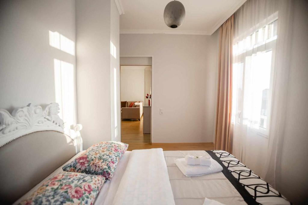 Postel nebo postele na pokoji v ubytování Apartment Kutaisi 248