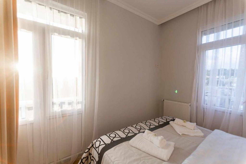 Postel nebo postele na pokoji v ubytování Apartment Kutaisi 248