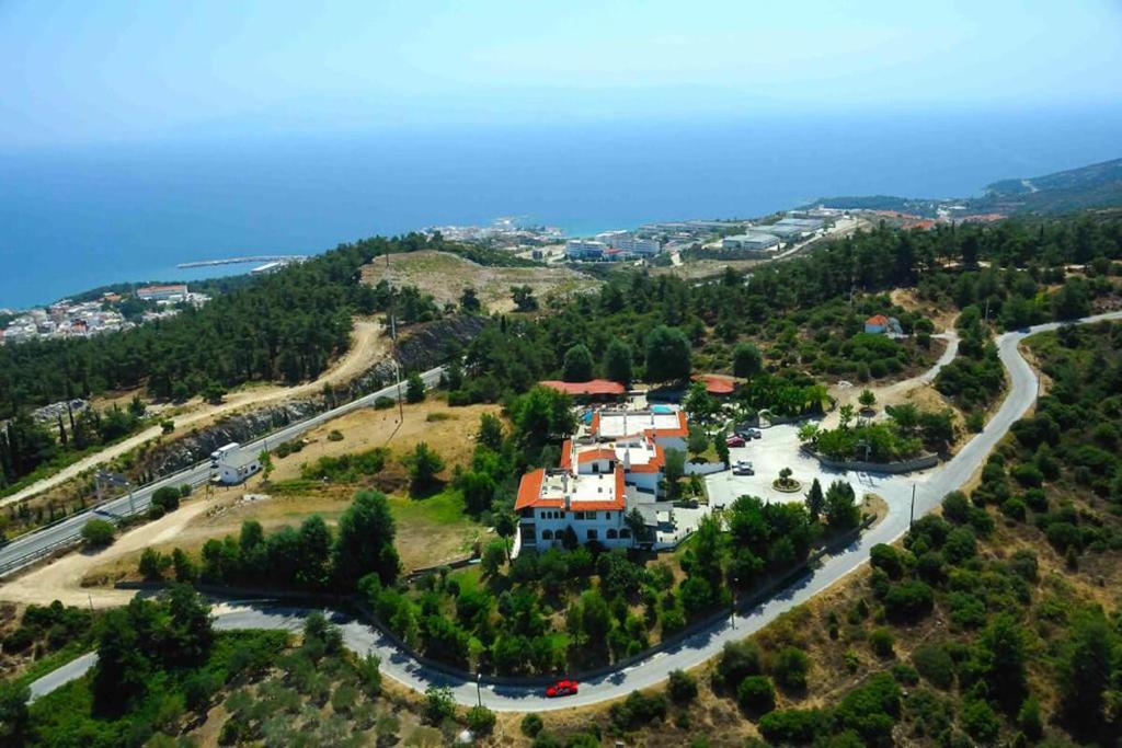an aerial view of a house on a hill with a road at Philoxenia in Kavala