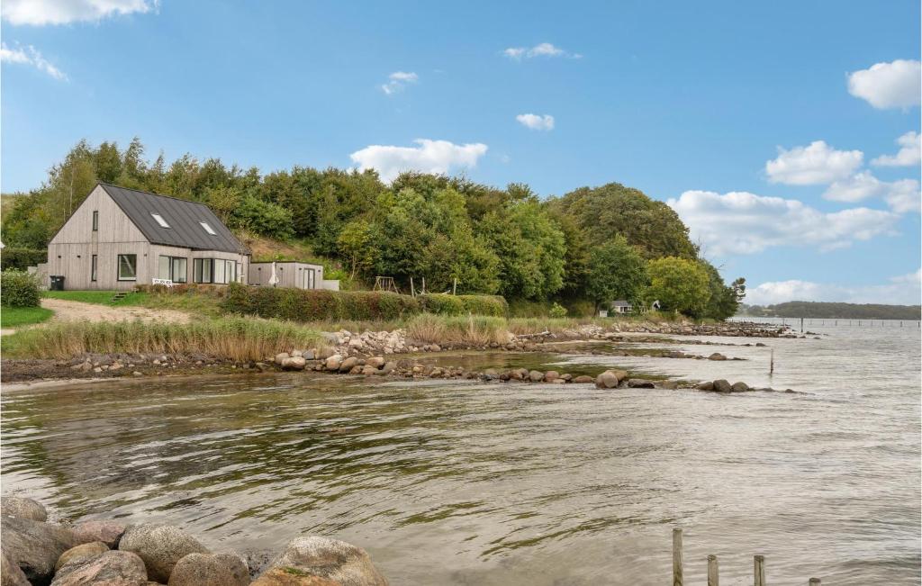 a house on the shore of a river at Lovely Home In Fredericia With House Sea View in Fredericia